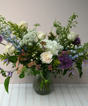 white and purple sympathy bouquet